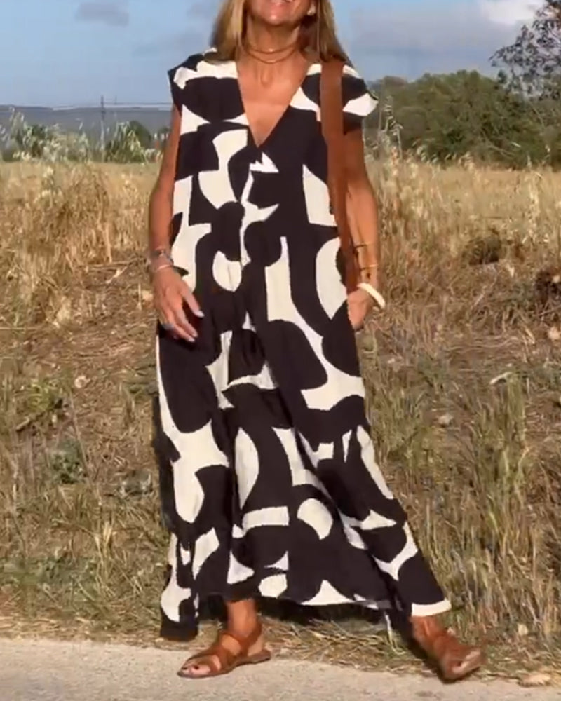 Išskirtinio rašto patogi V formos iškirptės suknelė
