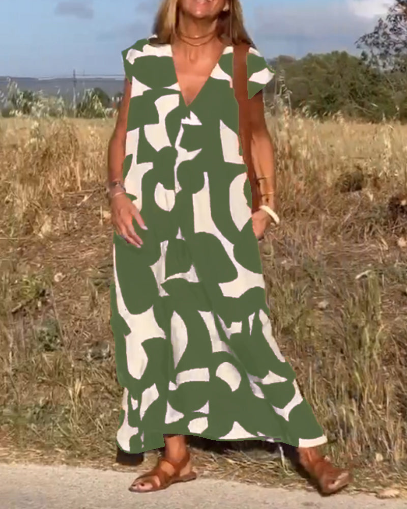 Išskirtinio rašto patogi V formos iškirptės suknelė